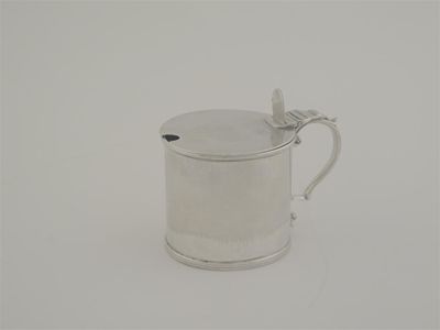 Appraisal: A George IV Irish plain drum mustard pot scroll handle