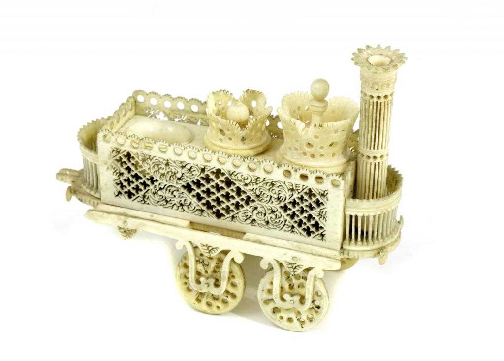 Appraisal: SEWING TOOLS AN IVORY BOBBIN STAND IN THE FORM OF