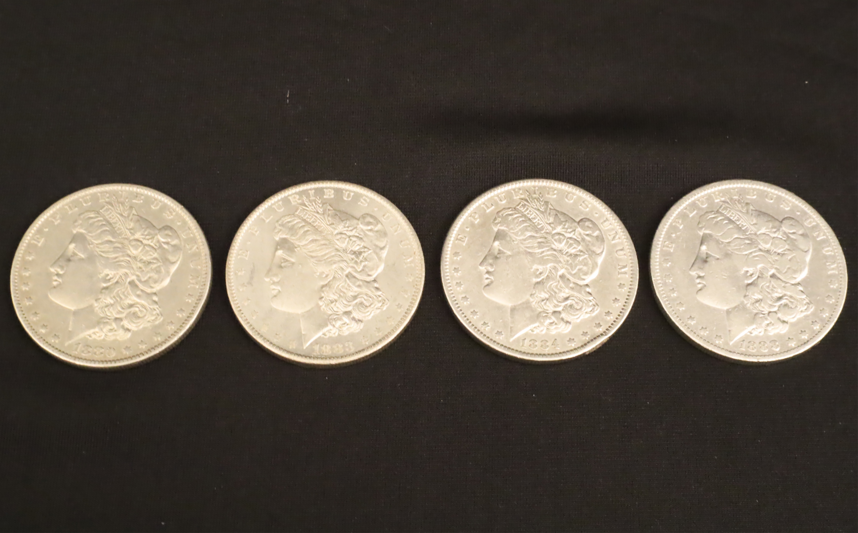 Appraisal: FOUR PRE- HIGH QUALITY MORGAN SILVER DOLLARS Group of Pre-