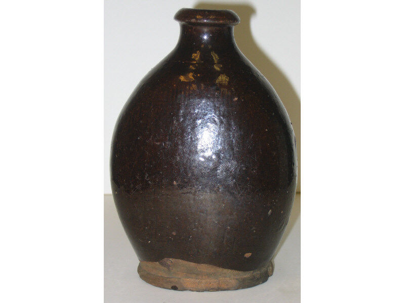 Appraisal: AMERICAN REDWARE FLASK Probably Massachusetts brown glaze Height inches Estimate