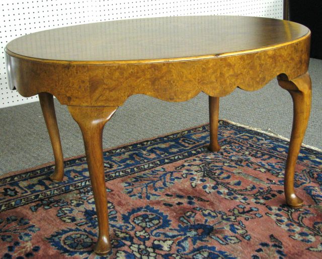 Appraisal: Baker Furniture Queen Anne Oval Cocktail Table with burl veneer