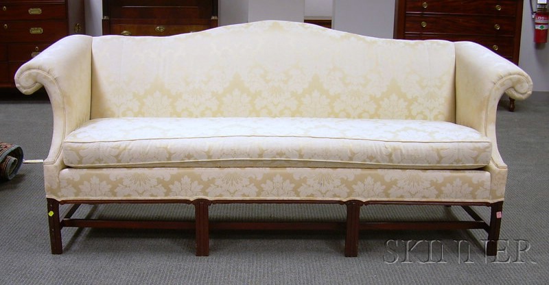 Appraisal: Clyde Pearson Chippendale-style Damask Upholstered Camel-back Carved Mahogany Sofa with