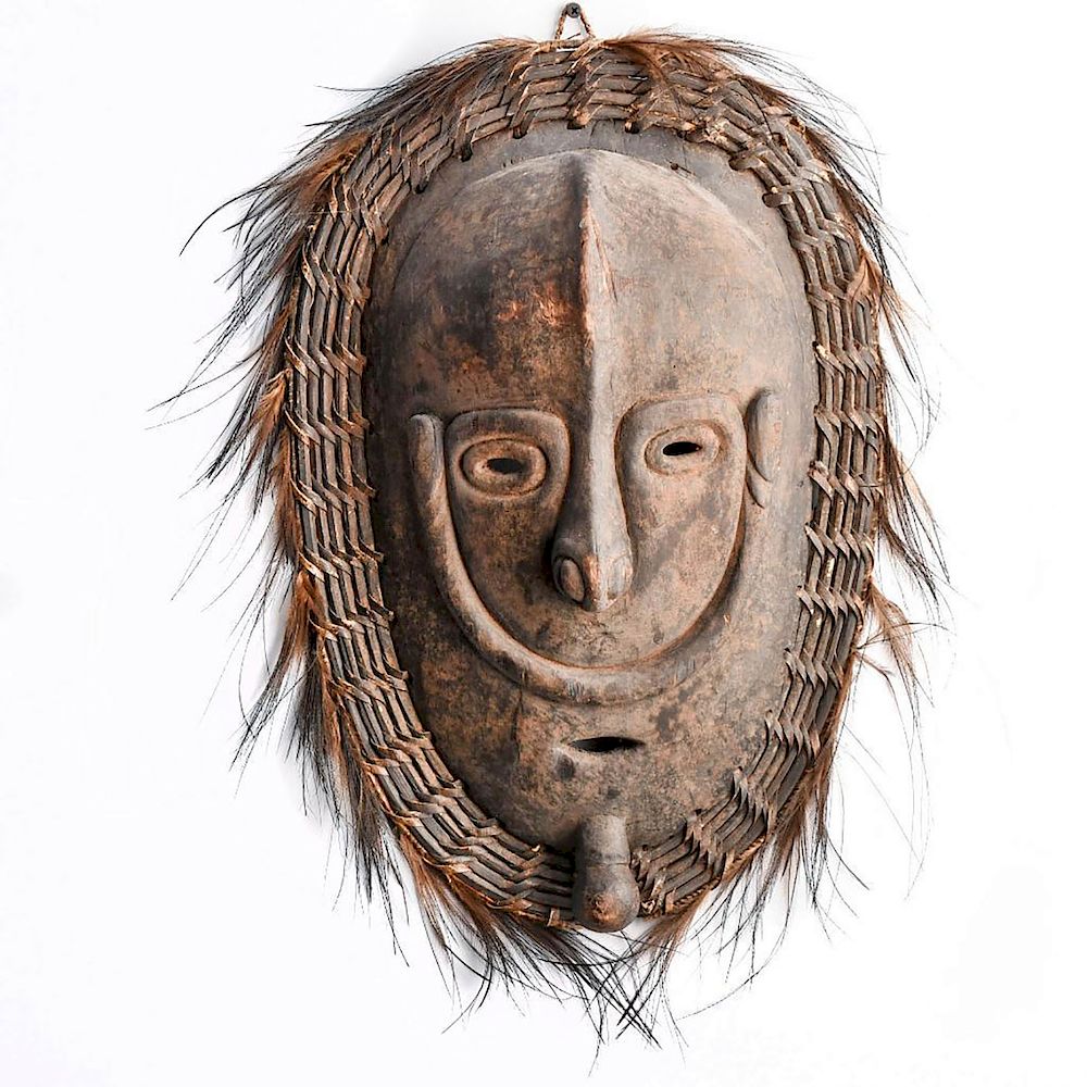 Appraisal: LARGE AFRICAN CARVED WOOD MASK Mask is surrounded by lashed