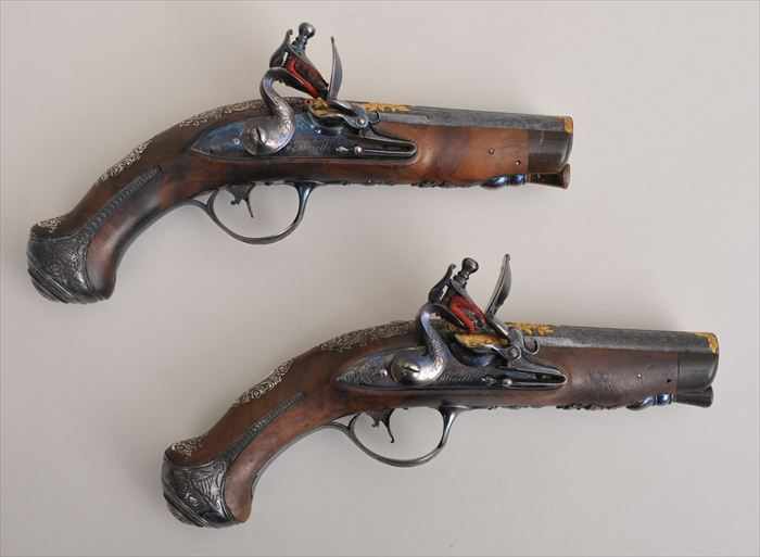 Appraisal: PAIR OF ITALIAN SILVER GILT-METAL AND STEEL-MOUNTED SINGLE-BARREL PISTOLS Signed