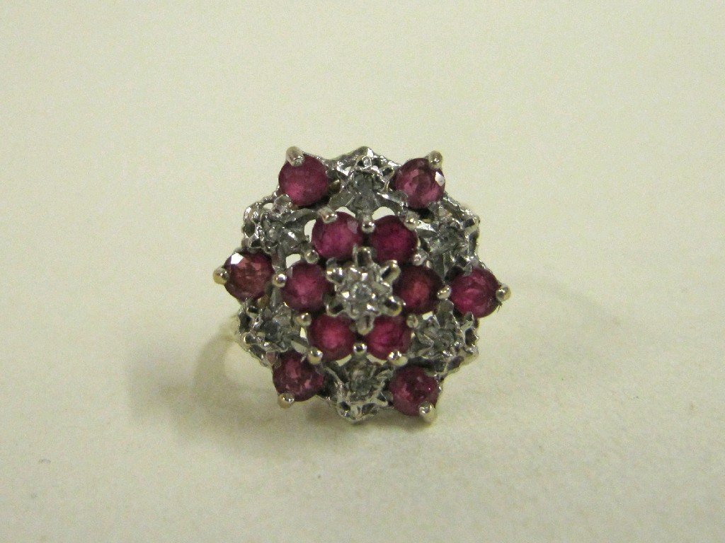 Appraisal: Nine carat gold ruby and diamond cluster ring