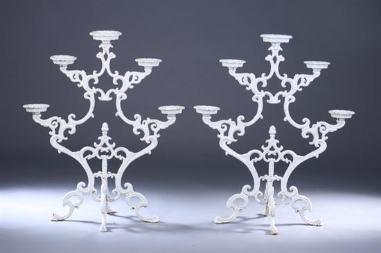 Appraisal: PAIR ROCOCO REVIVAL WROUGHT IRON GARDEN CANDELABRA th century Each