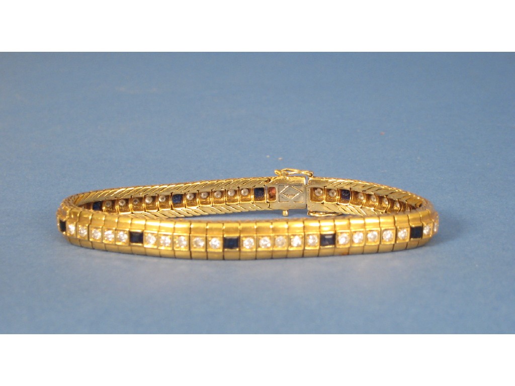 Appraisal: An k gold Bracelet set fifty diamonds and ten sapphires