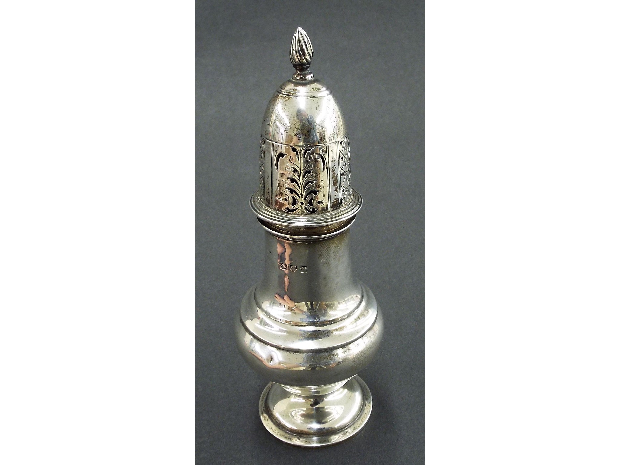 Appraisal: Late Victorian silver baluster caster with flambeau finial diaper and