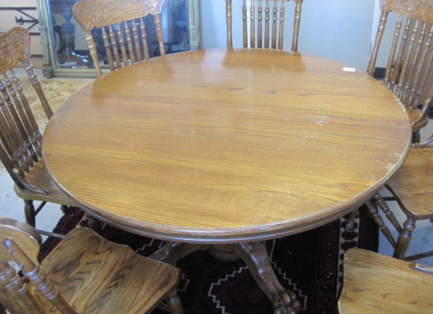 Appraisal: OAK DINING TABLE AND CHAIR GROUP American antique reproduction c