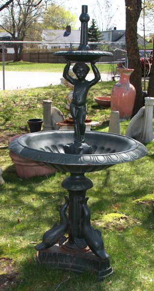 Appraisal: Figural cast iron fountain with dolphin base h x diam