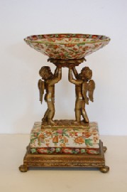 Appraisal: CONTEMPORARY CHERUB SUPPORTED CERAMIC CENTREPIECE