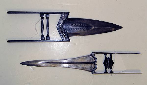 Appraisal: Two Indian katars One forged in one piece with narrow