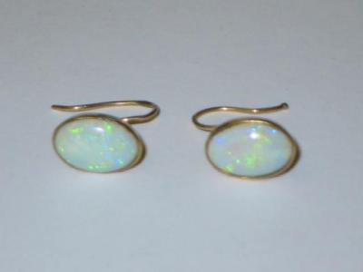 Appraisal: A PAIR OF OPAL EARRINGS the oval cabochon stones collet