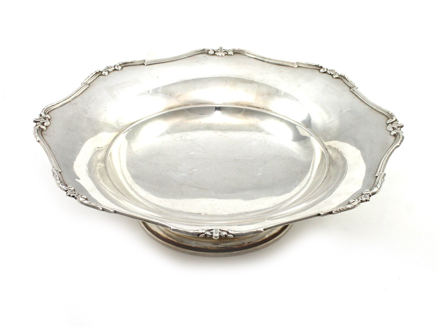 Appraisal: A silver shaped circular fruit dish decorated with a scrolling