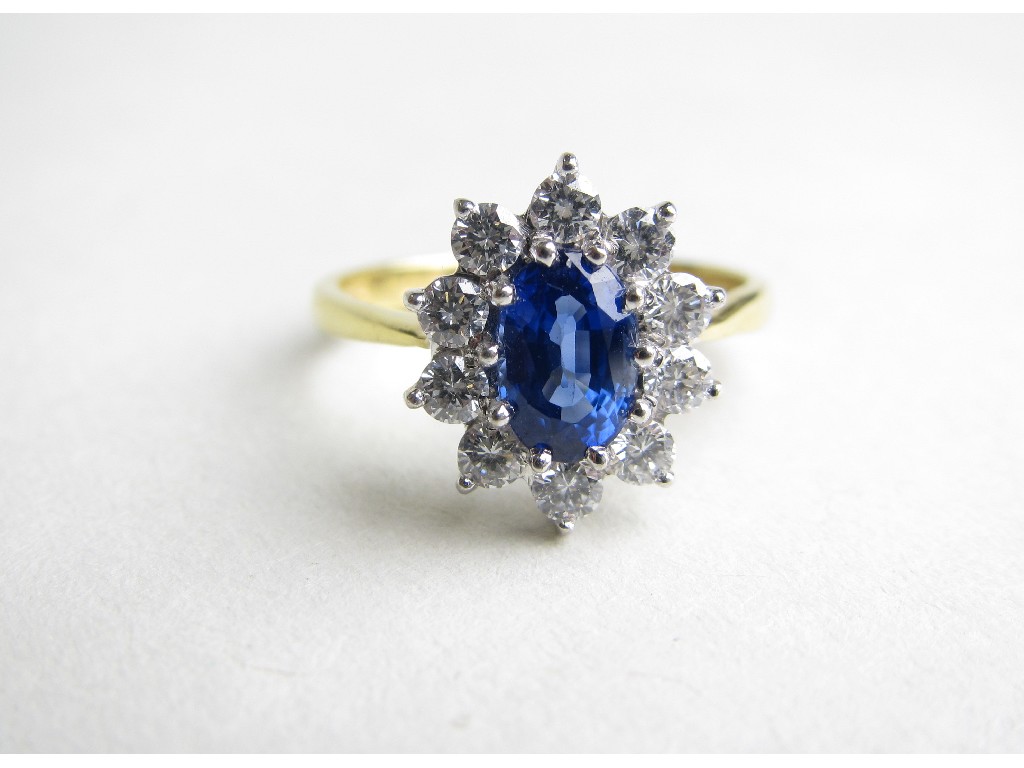 Appraisal: Eighteen carat gold Ceylon sapphire and diamond cluster ring