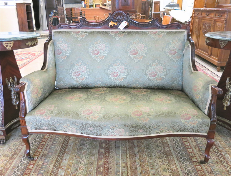 Appraisal: LATE VICTORIAN WING-BACK SETTEE English c having a carved and