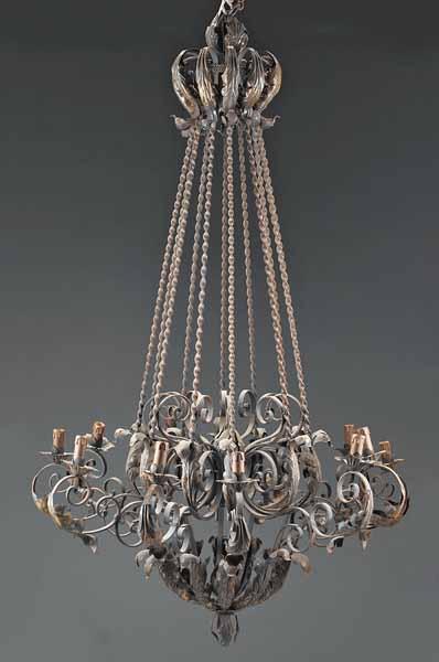 Appraisal: A Renaissance-Style Wrought Iron Twelve-Light Chandelier the corona mounted with