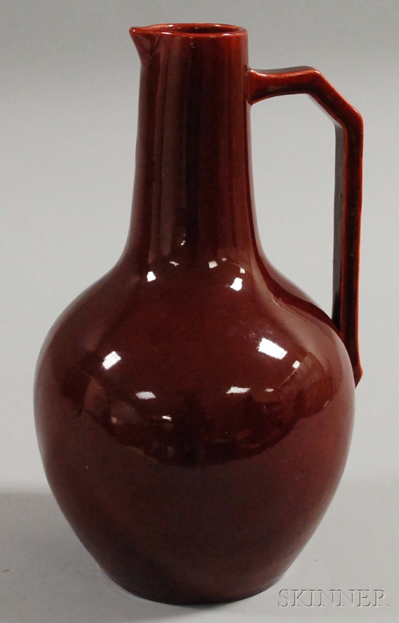 Appraisal: European Sang de Boeuf Glazed Pottery Pitcher bulbous pear-shaped body