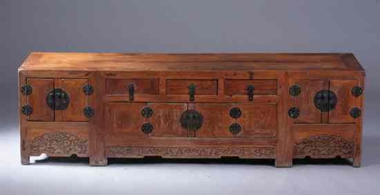 Appraisal: CHINESE ELMWOOD LOW CABINET th century The rectangular top above