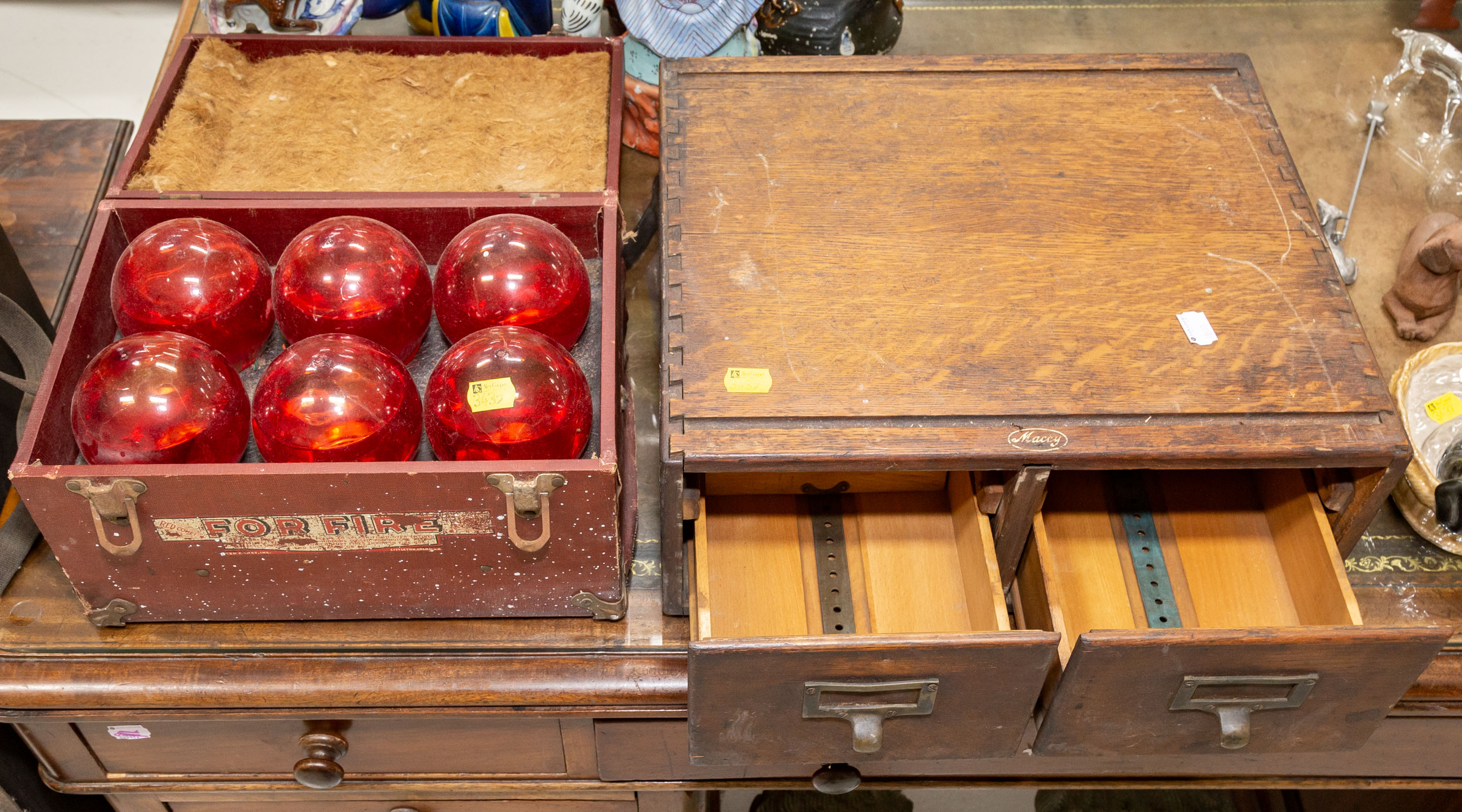 Appraisal: CASED SET OF FIRE GRENADES Manufactured by Red Comite with