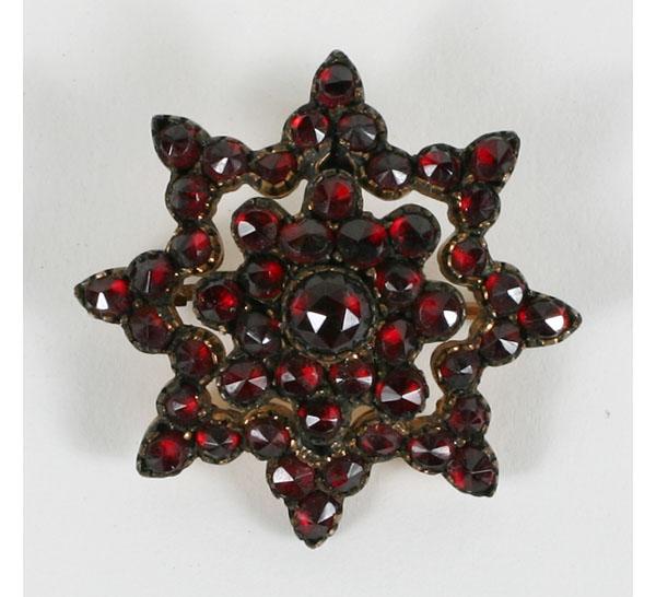 Appraisal: Victorian gold plated tiered garnet star pin dia