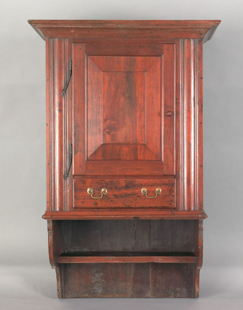 Appraisal: Pennsylvania pine and walnut hanging cupboard early th c the