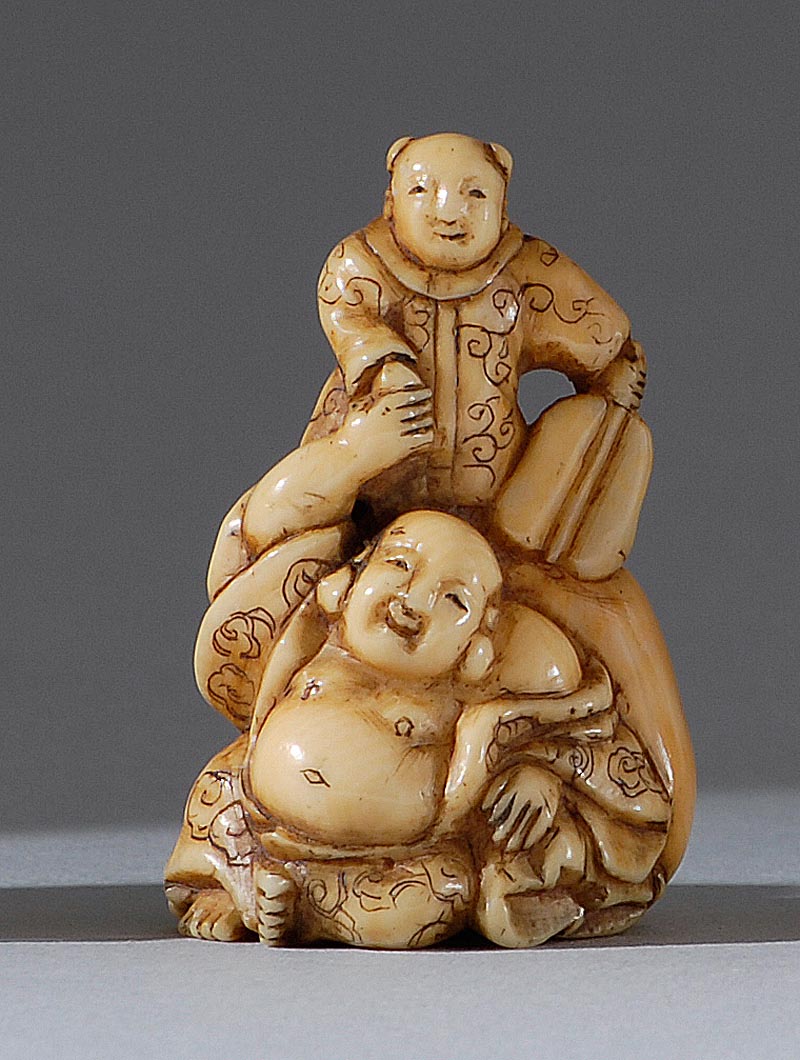 Appraisal: IVORY NETSUKE th CenturyIn the form of Hotei and a