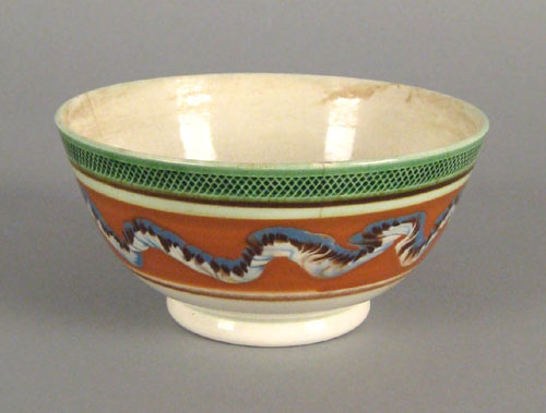 Appraisal: English mocha bowl with earthworm decoration on a rust ground