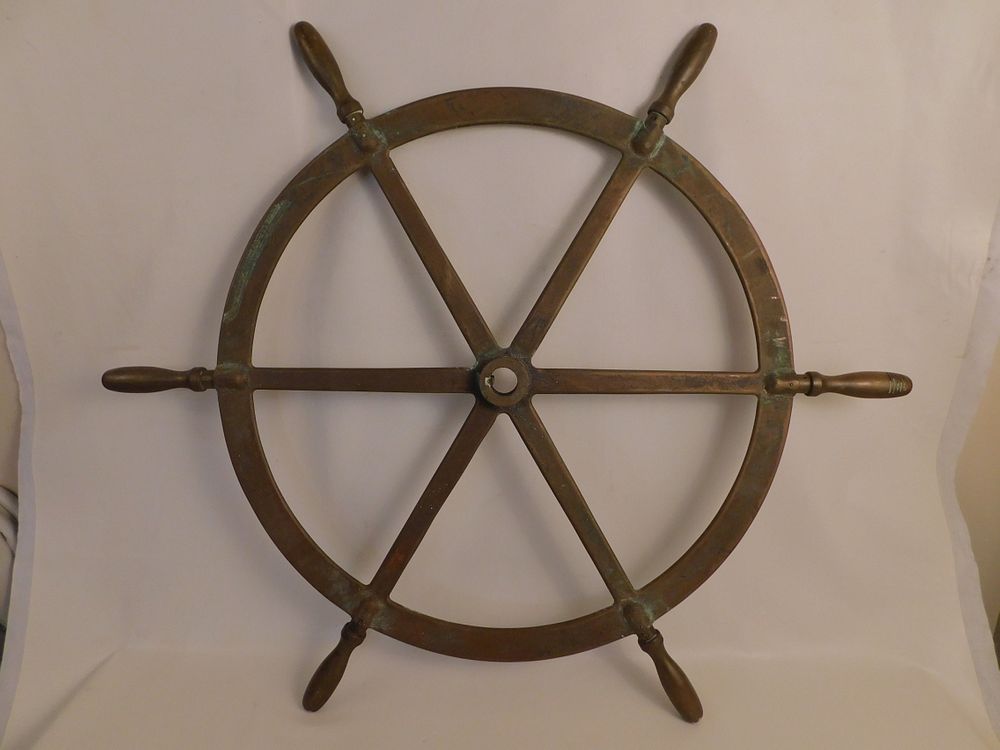 Appraisal: ANTIQUE BRONZE SHIPS WHEEL Heavy antique solid bronze ships wheel