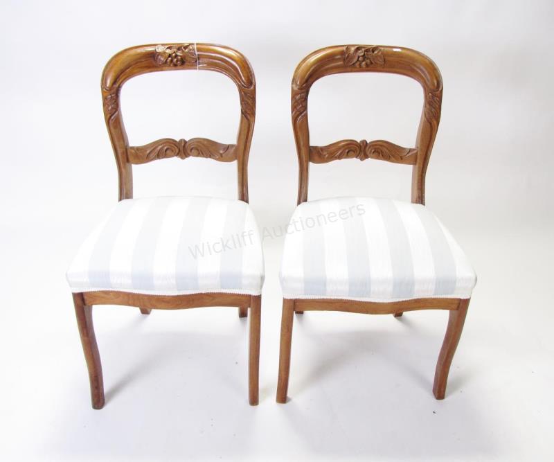 Appraisal: A pair of walnut Victorian side chairs upholstered seats with