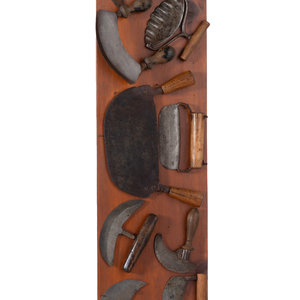 Appraisal: A Collection of Wrought Iron Kitchen Tools Mounted to Panel