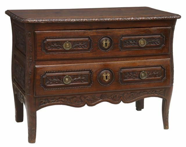 Appraisal: French Provincial commode th c richly carved oak case with