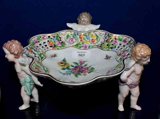 Appraisal: A DRESDEN PORCELAIN TRIFORM TABLE CENTRE with pierced flower decorated