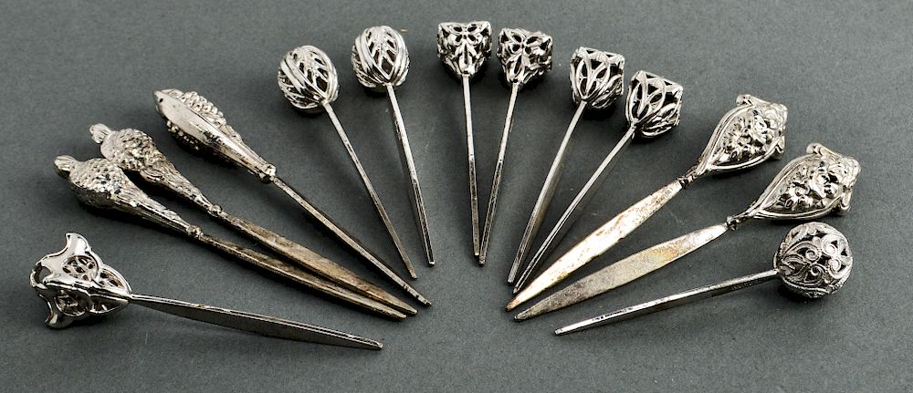 Appraisal: Silver Repousse Pierced Hors D'Hoeuvre Picks Group of sterling silver