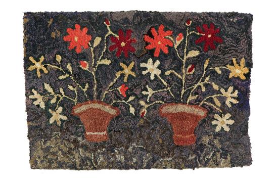 Appraisal: HOOKED RUG American early th century Two pots with red