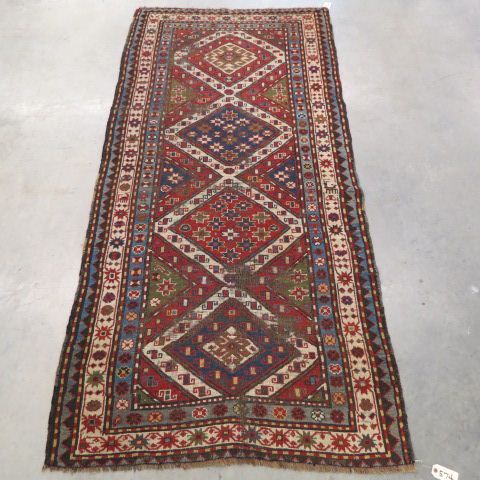 Appraisal: Kazak Persian Handmade Rug antique geometrics florals in triangular medallions