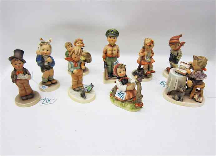 Appraisal: NINE GERMAN HUMMEL PORCELAIN FIGURINES TM- - ''Street Singer ''