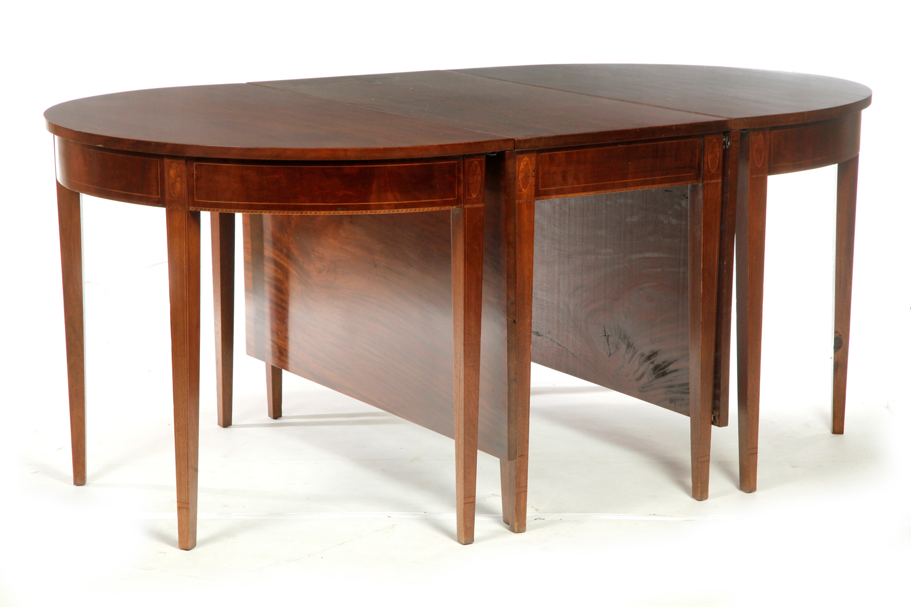 Appraisal: HEPPLEWHITE-STYLE THREE-PART DINING TABLE American th century mahogany Central drop-leaf