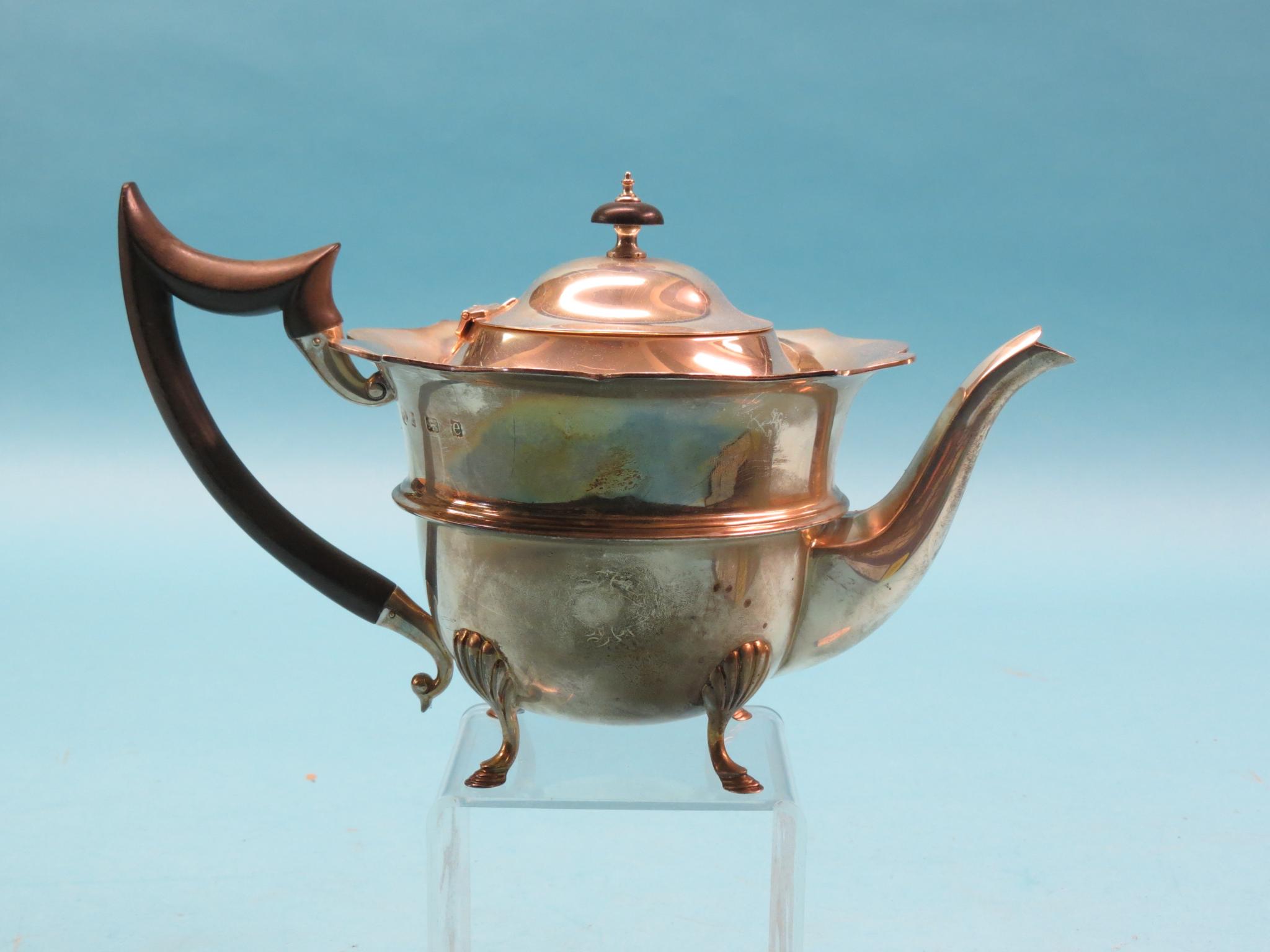 Appraisal: An Edward VII silver teapot circular with shell feet Birmingham