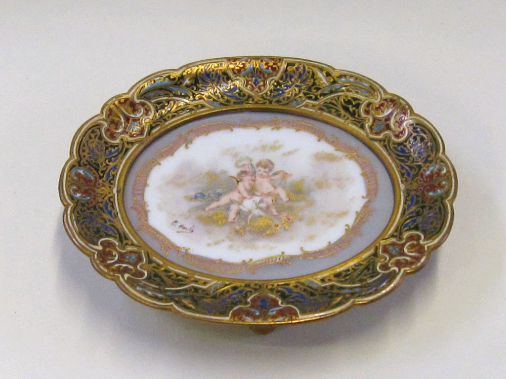 Appraisal: Handpainted porcelain plaque decorated with two puttis with a dove