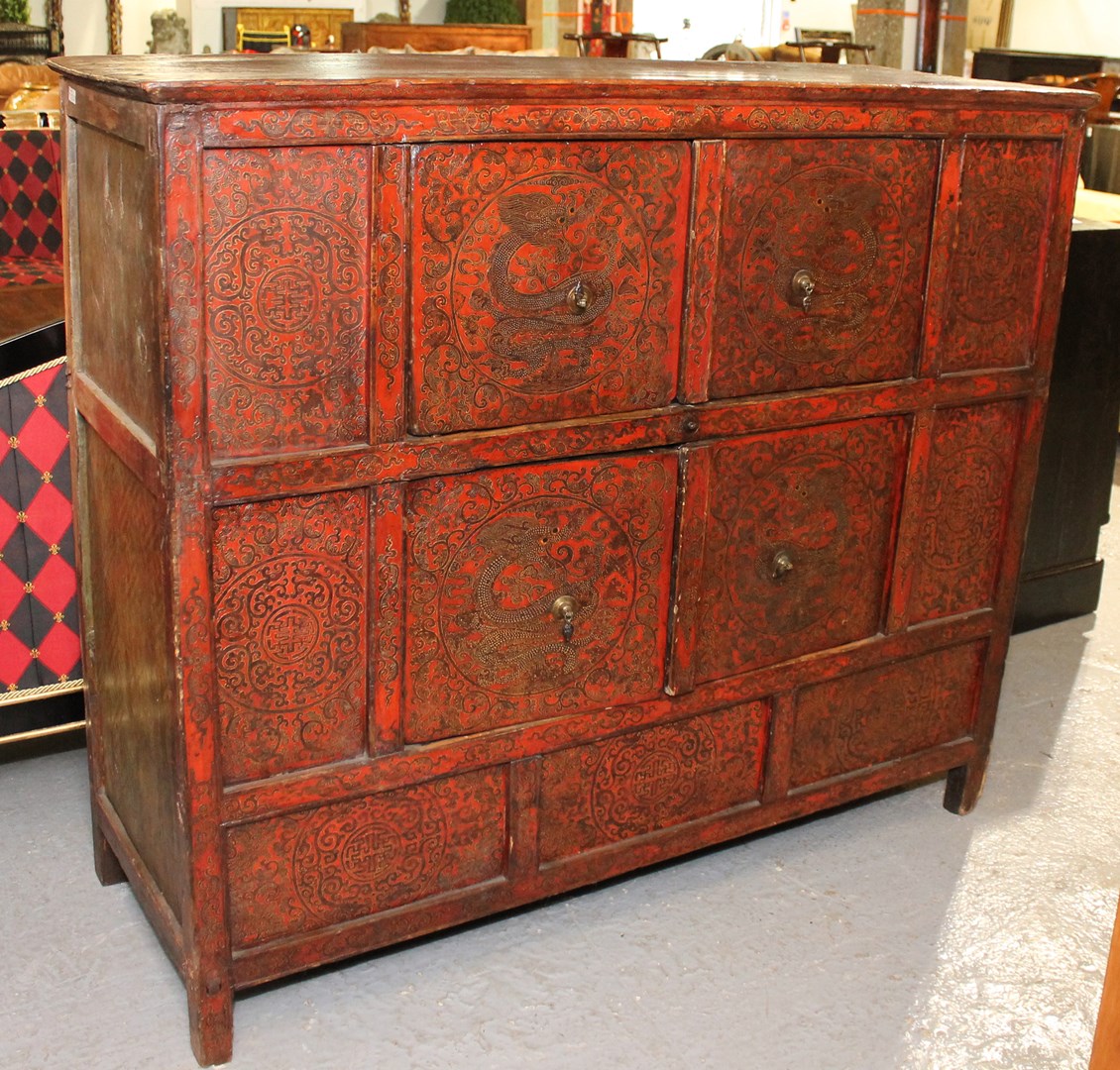 Appraisal: A th century Eastern red lacquer side cabinet with two