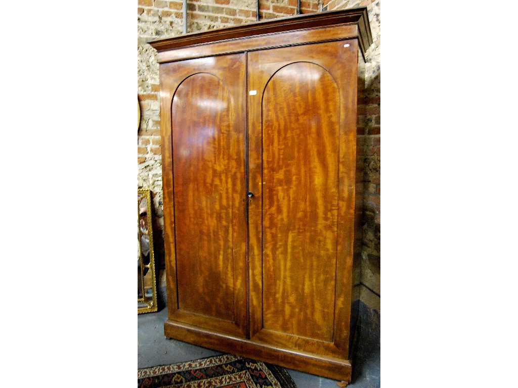 Appraisal: A Victorian mahogany cupboard press the pair of full-height arched