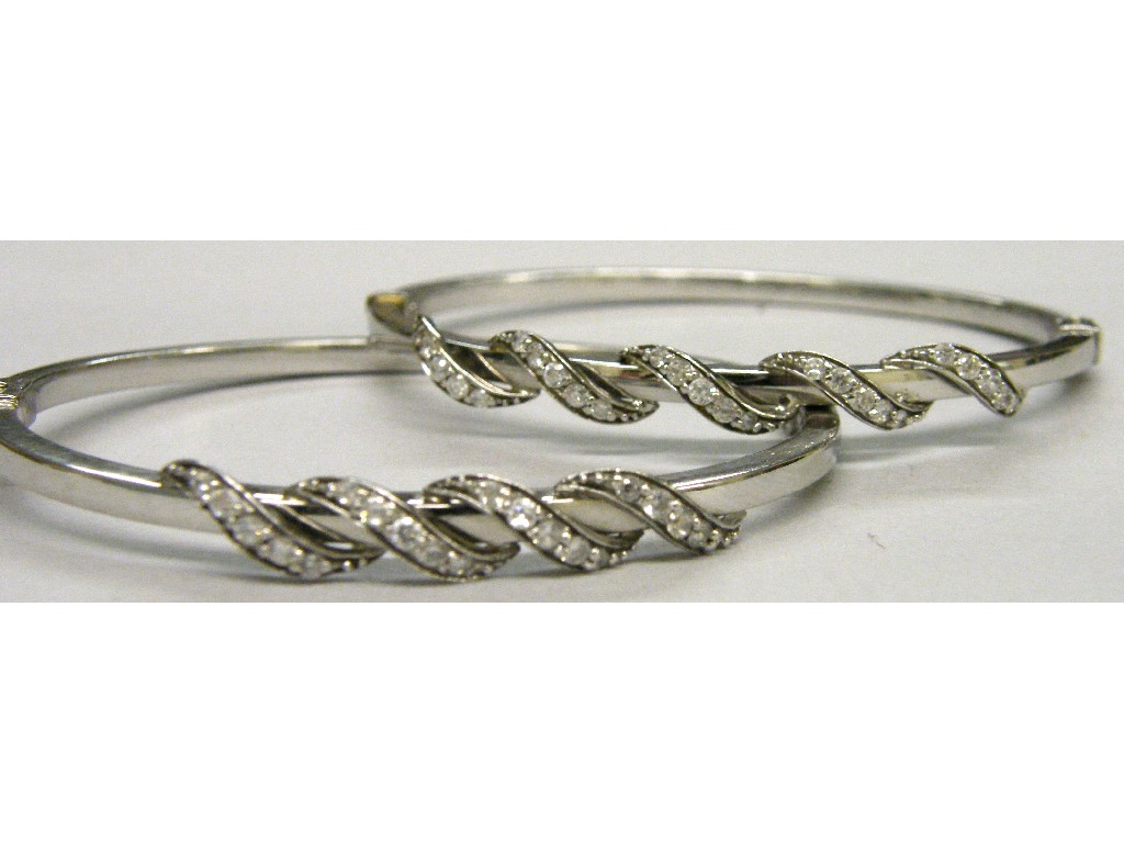 Appraisal: Two similar ct white gold cz set bangles gm