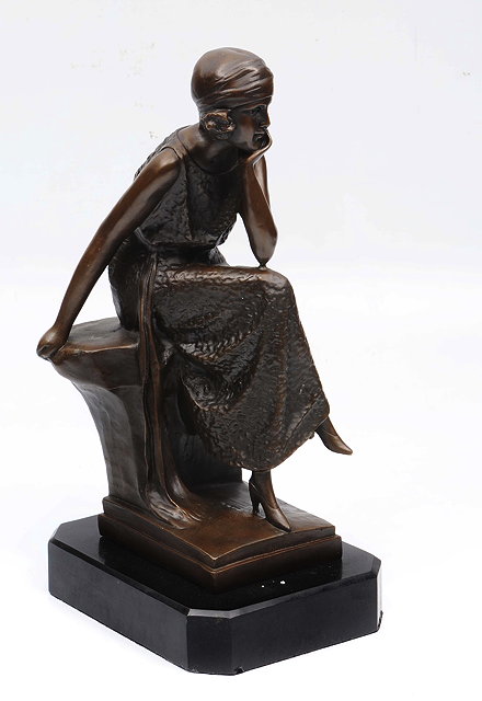 Appraisal: A CONTEMPORARY BRONZE SCULPTURE OF A GIRL SEATED IN A