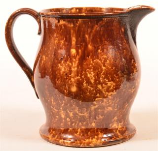 Appraisal: Rockingham Glazed Yellowware Pitcher Rockingham Glazed Yellowware Bulbous Form Pitcher