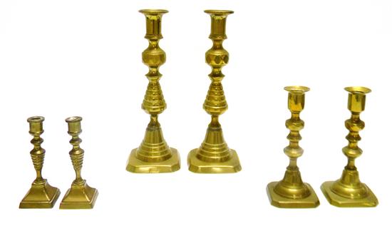 Appraisal: Three pairs th th C brass candle sticks pair c