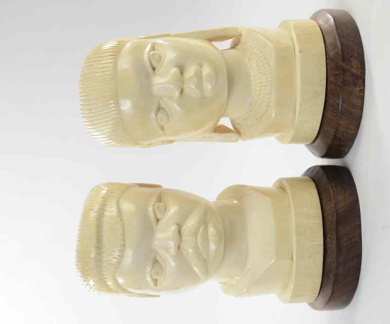 Appraisal: PAIR HEAVY ELEPHANT IVORY CARVED BUSTS Man with mustache and