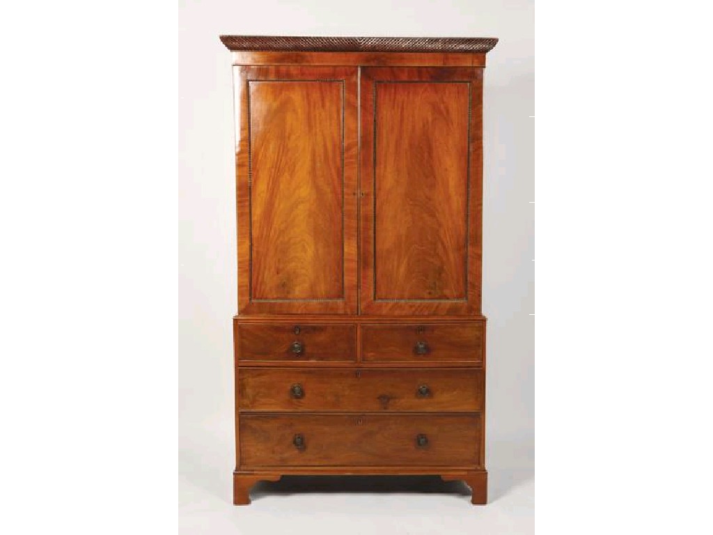 Appraisal: A REGENCY MAHOGANY LINEN PRESS with a moulded and reeded