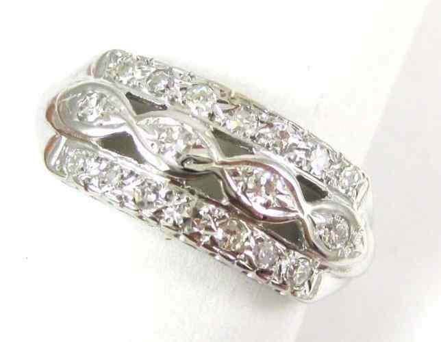 Appraisal: DIAMOND AND FOURTEEN KARAT WHITE GOLD RING set with bed