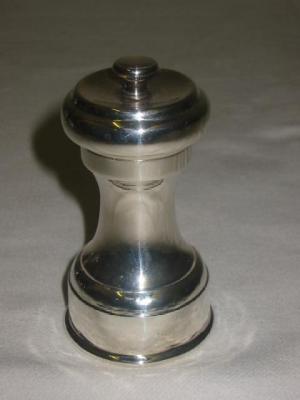 Appraisal: A PEPPER GRINDER of waisted form high Chester